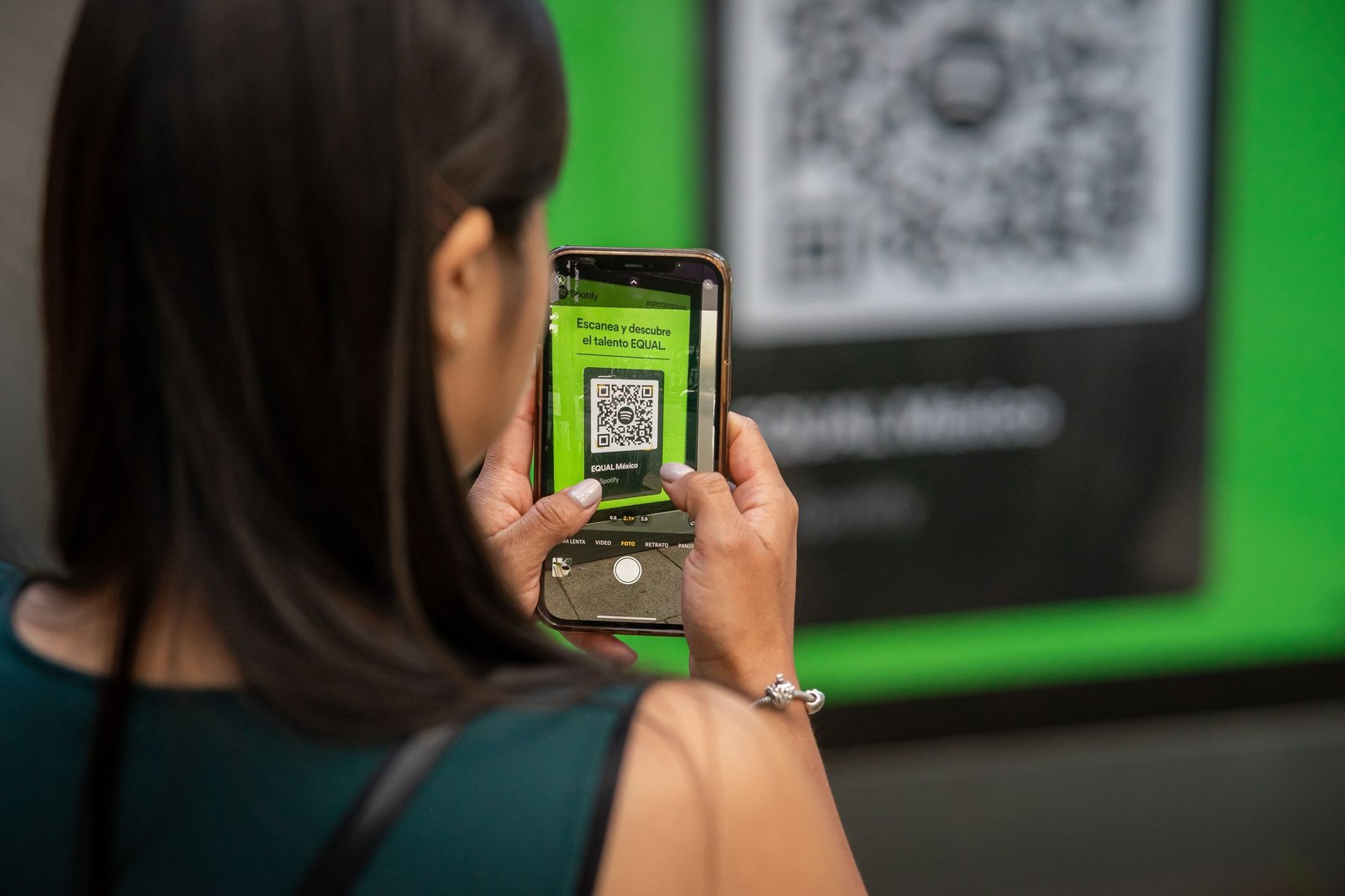 Person scanning a QR code with a smartphone